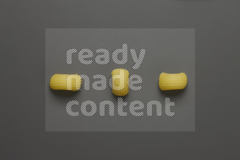 Elbow pasta on grey background