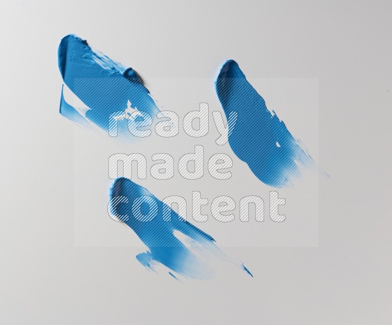 Blue painting knife strokes on white background