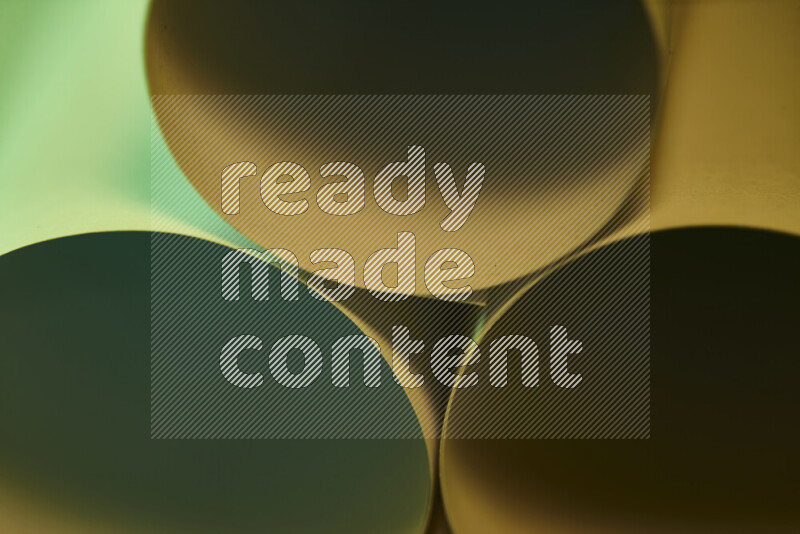 The image shows an abstract paper art with circular shapes in varying shades of green and warm tones