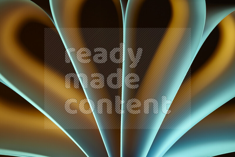 An abstract art piece displaying smooth curves in yellow and green gradients created by colored light