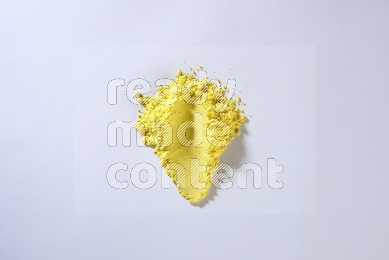 Yellow powder smears on white background