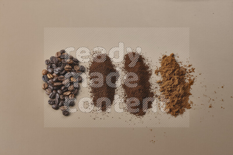Assorted kinds of coffee such as roasted beans and ground on beige background