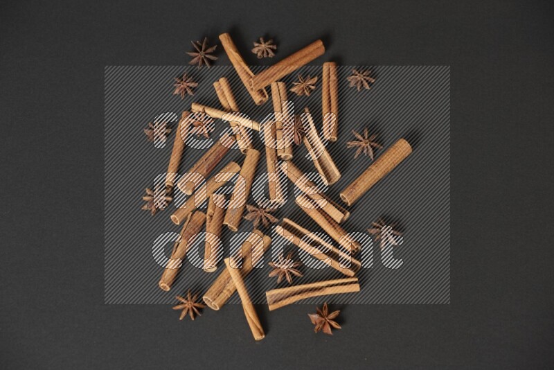 Cinnamon sticks and star anise on black background