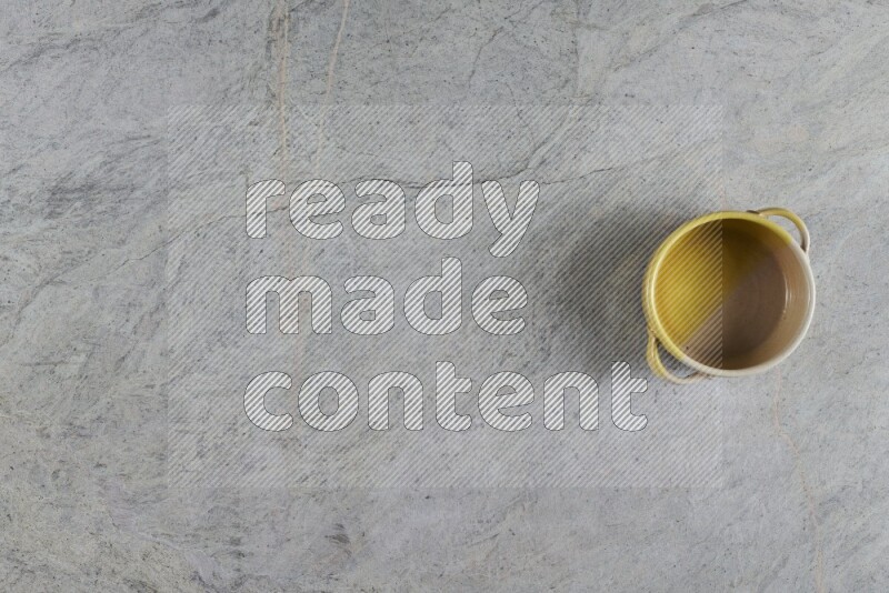 A multicolored pottery Bowl on grey marble background