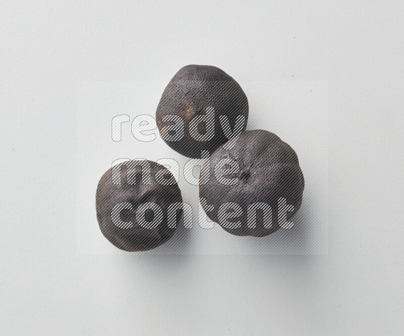 Top-view shot of dried lime (loomi) on white background
