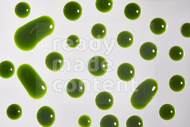 Close-ups of abstract green paint droplets on the surface