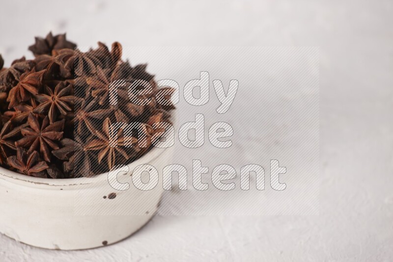 Star Anise in a white bowl on white background