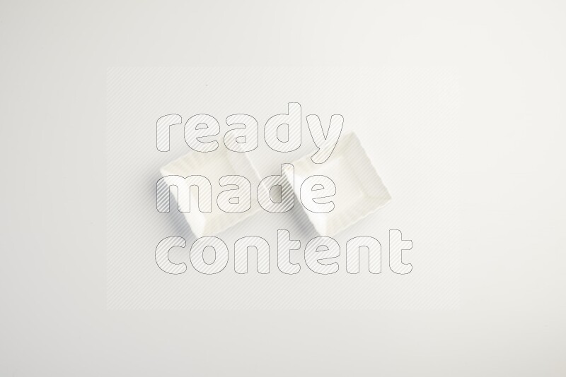 white ceramic square sauce dish on white countertop