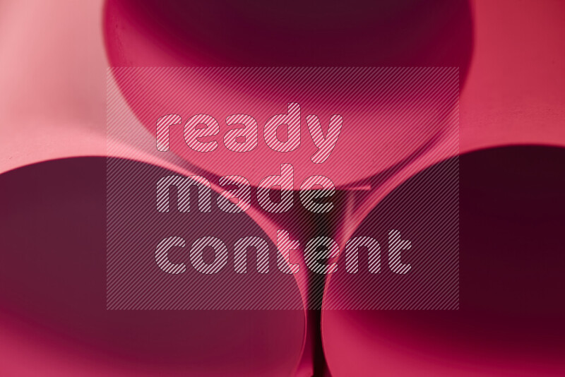 The image shows an abstract paper art with circular shapes in varying shades of red