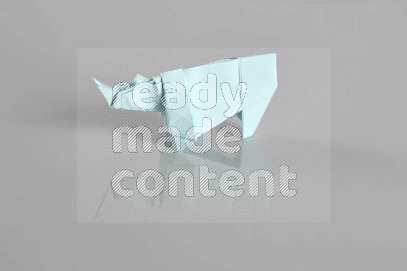 Origami animals on grey background