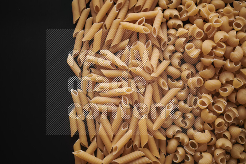 Different pasta types on black background
