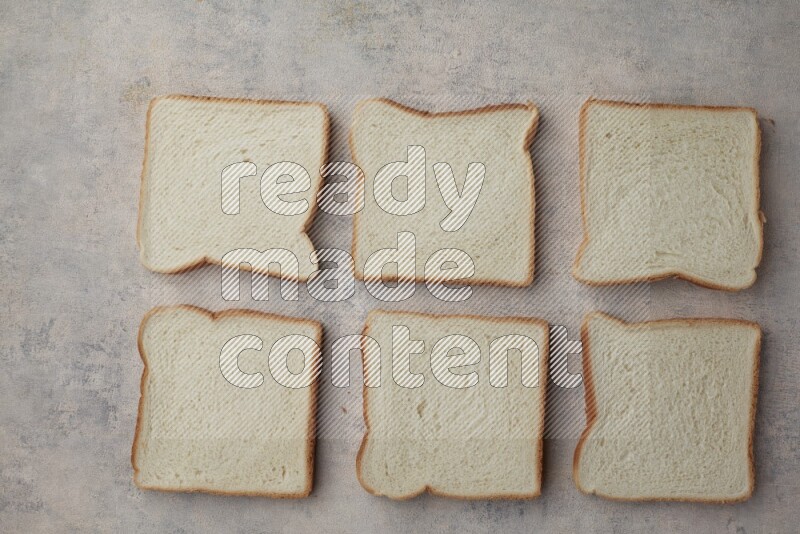 White Toast slices on alight blue textured background