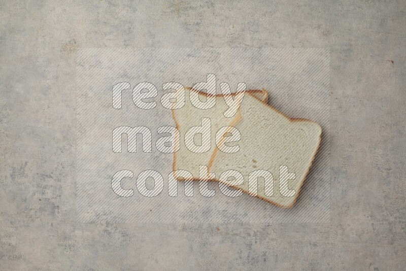 White Toast slices on alight blue textured background