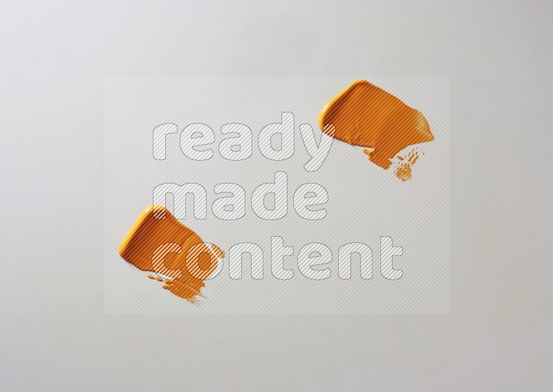Orange painting knife strokes on white background