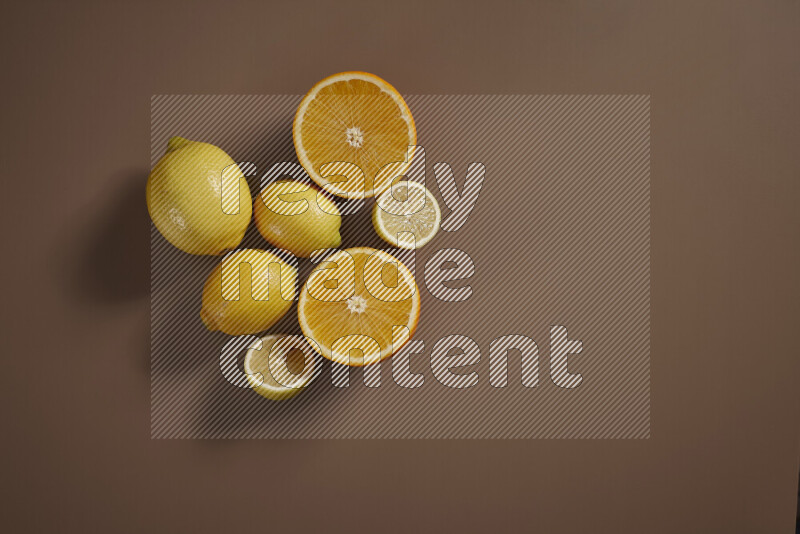 Some of citrus fruits such as lemon, lime and oranges lying on beige background
