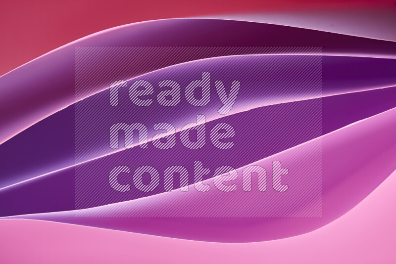 This image showcases an abstract paper art composition with paper curves in different warm gradients created by colored light