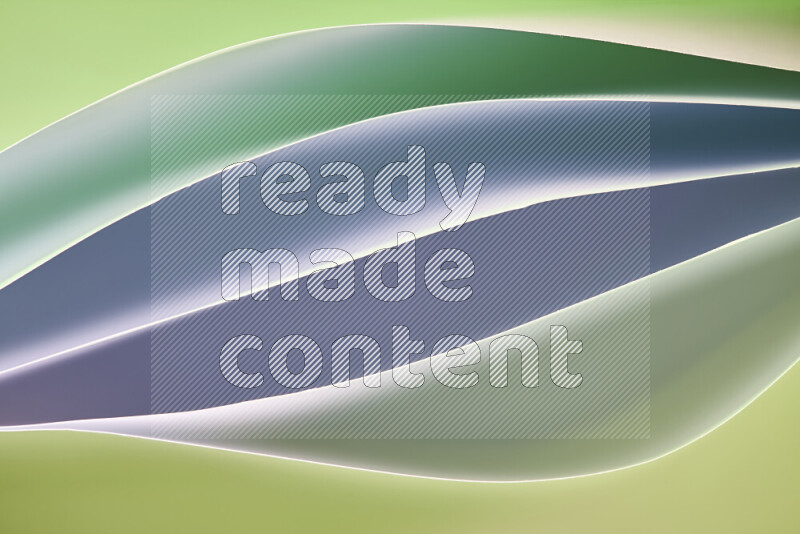 This image showcases an abstract paper art composition with paper curves in green gradients created by colored light