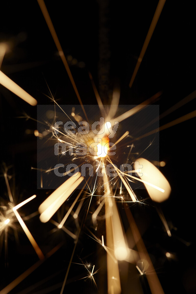 A close-up image of sparkler candle isolated on black background