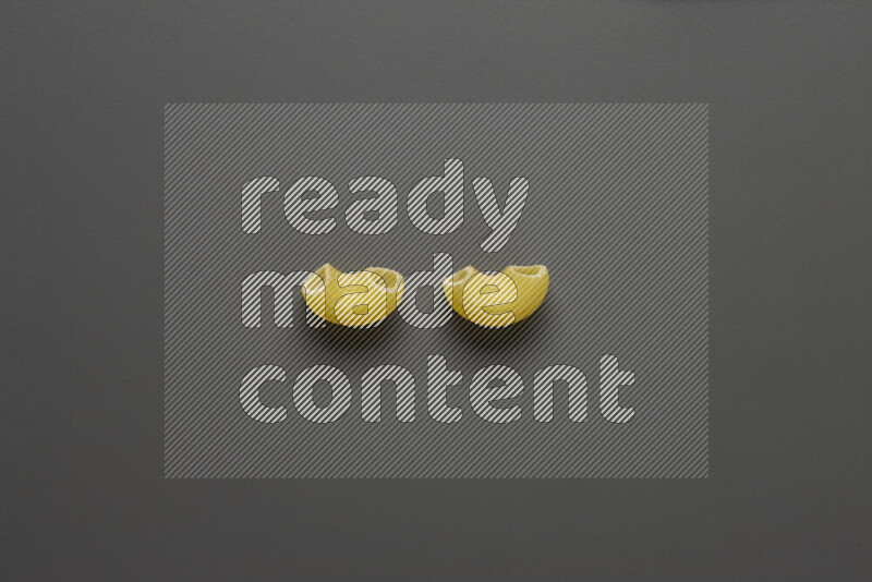 Elbow pasta on grey background