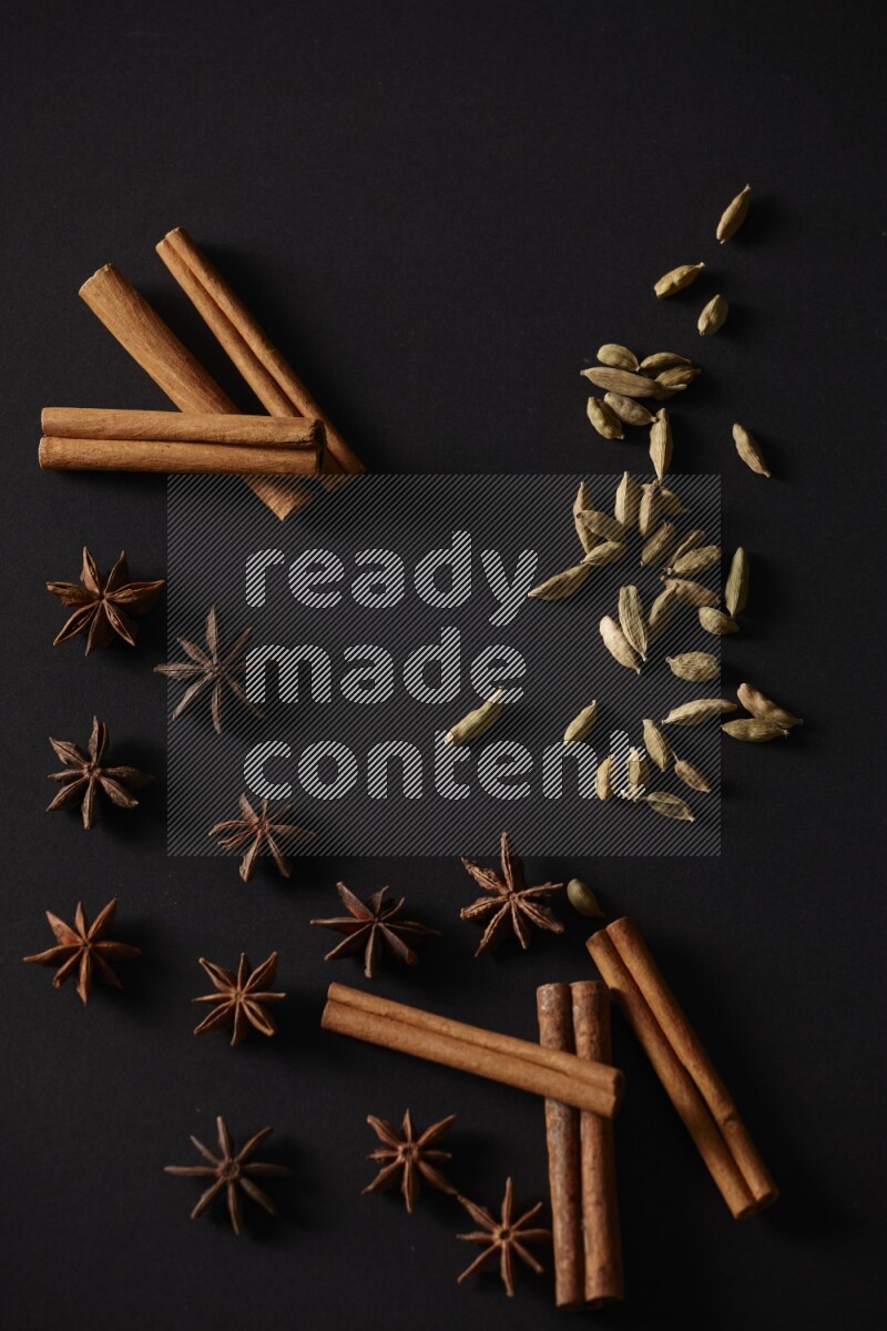Cinnamon Sticks, Cardamom and star anise on a black background