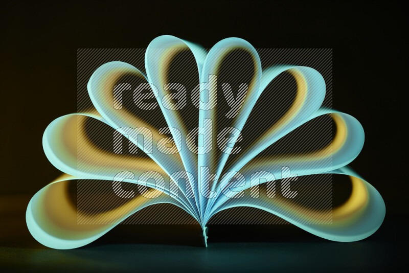 An abstract art piece displaying smooth curves in yellow and green gradients created by colored light