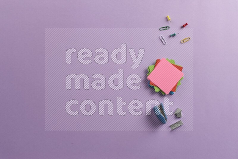 Multicolored sticky notes with school supplies on purple background