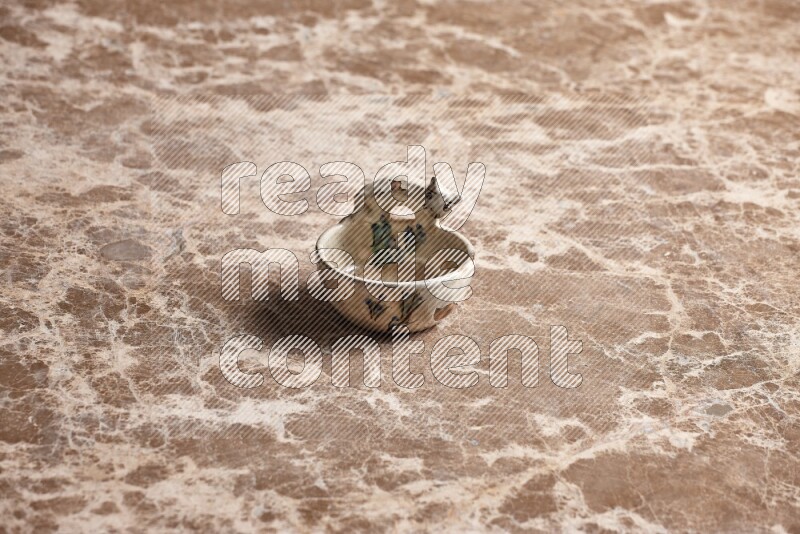 A pottery soap holder on beige marble background