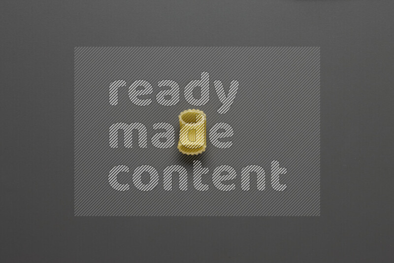 Elbow pasta on grey background