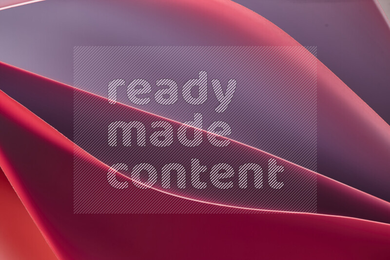 This image showcases an abstract paper art composition with paper curves in different warm gradients created by colored light