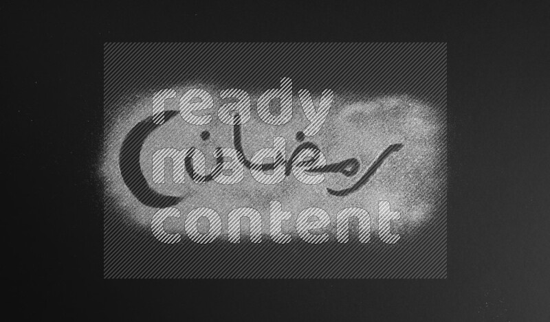 A word written with silver glitter on black background