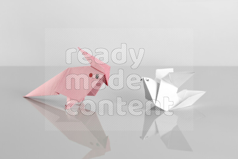 Origami animals on grey background