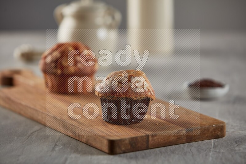 Peanut cupcake on a wooden board