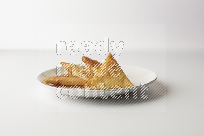 sambosas on a white background