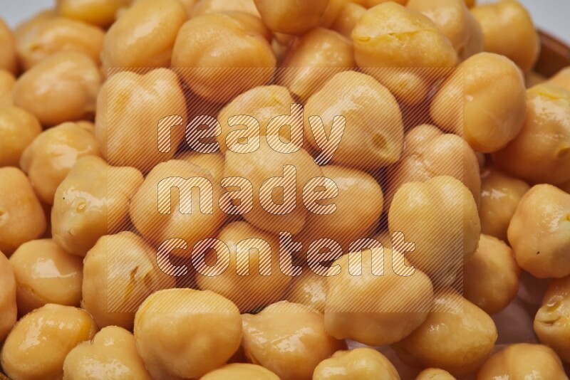 Close up shot of boiled chickpeas on white background