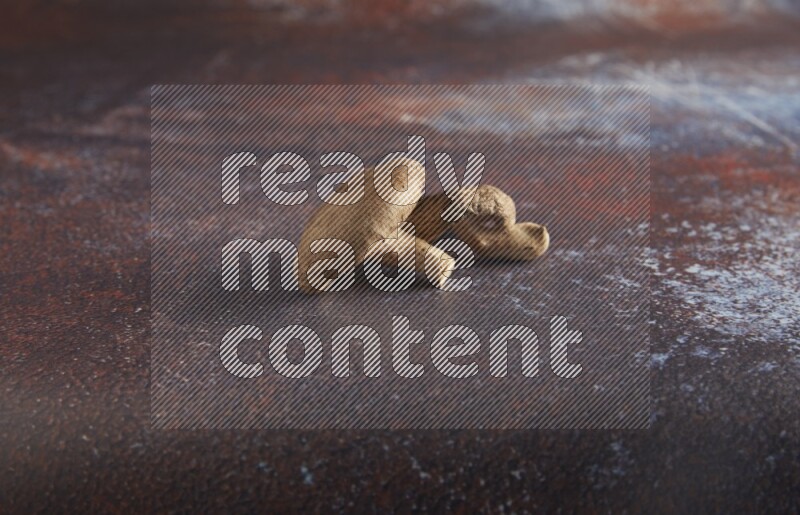 45 degre shiitake mushrooms on a textured reddish rustic metal background