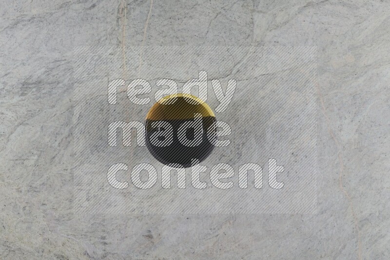 A multicolored pottery Bowl on grey marble background