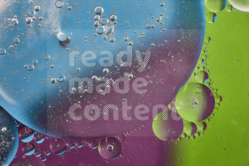 Close-ups of abstract oil bubbles on water surface in shades of purple, green and blue