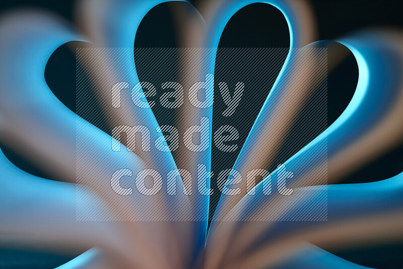 An abstract art piece displaying smooth curves in white and blue gradients created by colored light