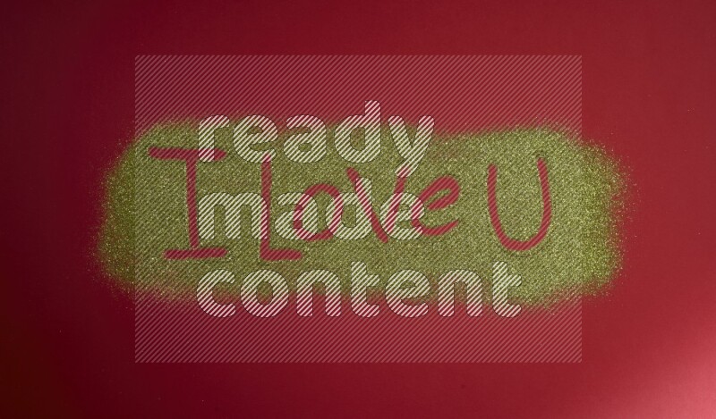 A sentence written with gold glitter on red background