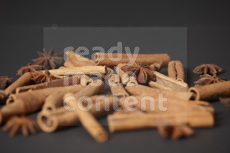 Cinnamon sticks and star anise on black background