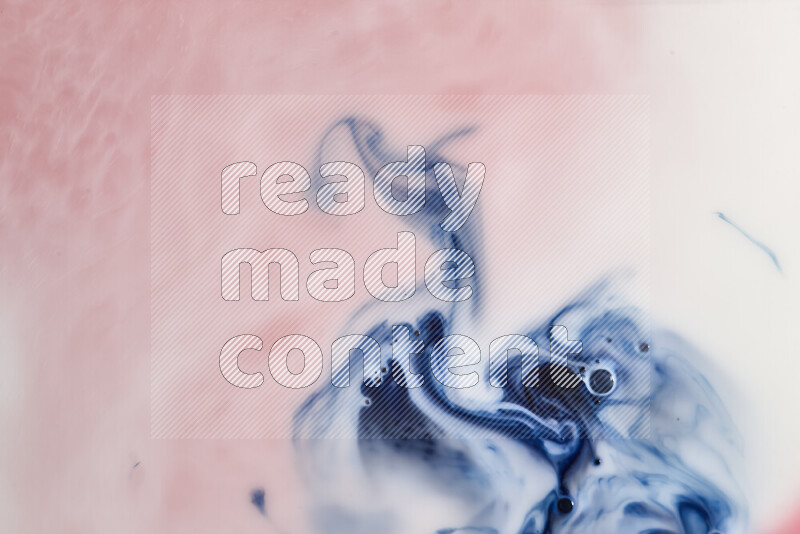 A close-up of abstract swirling patterns in blue, red and white