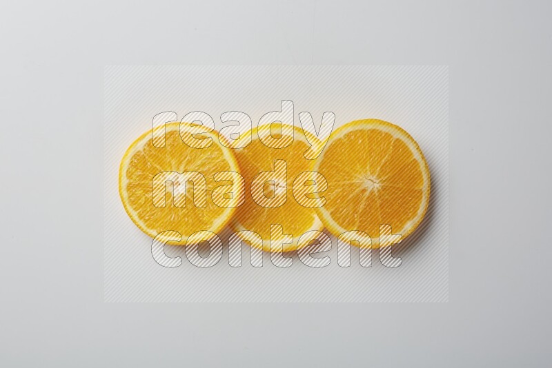Three orange slices on a white background