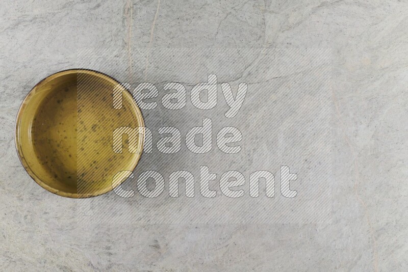 A multicolored pottery Bowl on grey marble background
