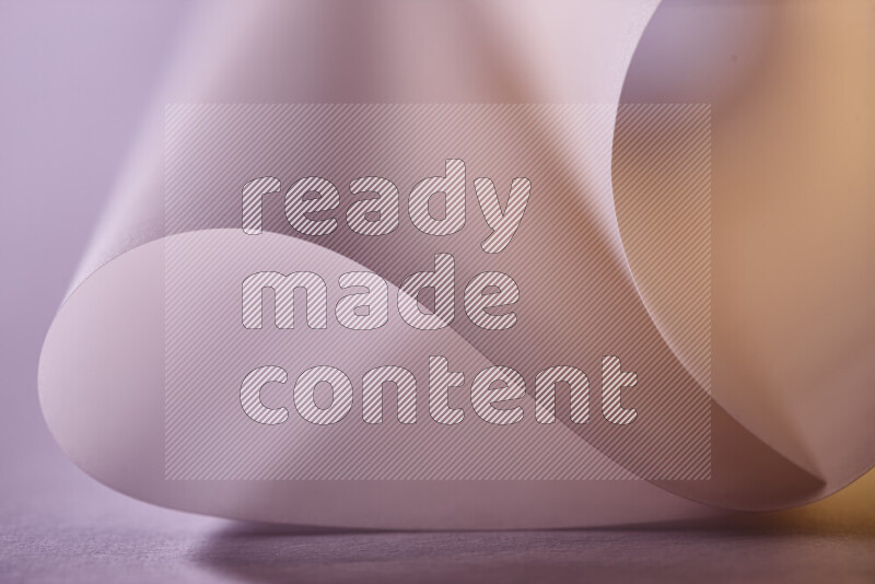 An abstract art piece displaying smooth curves in gold gradients created by colored light