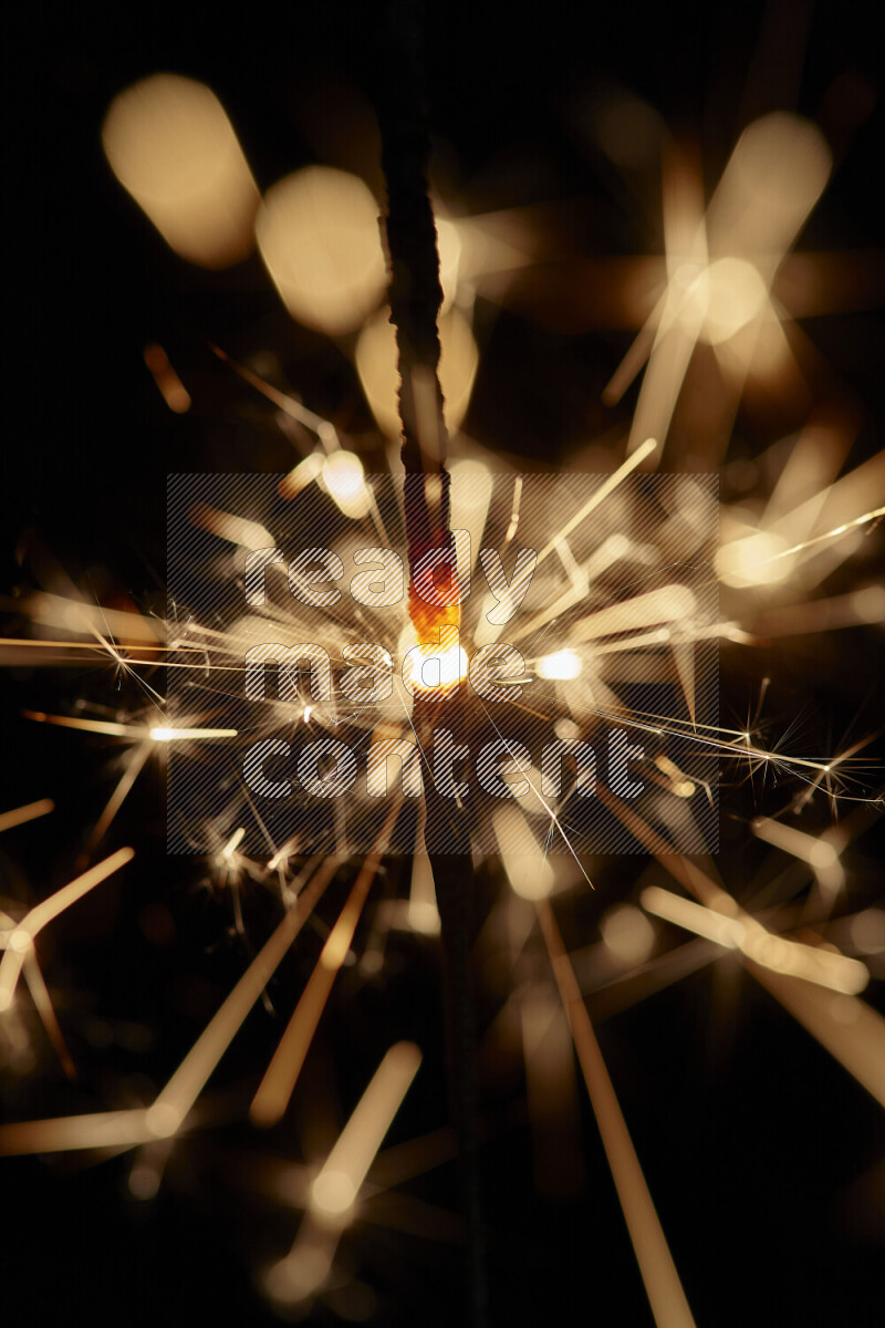 A close-up image of sparkler candle isolated on black background