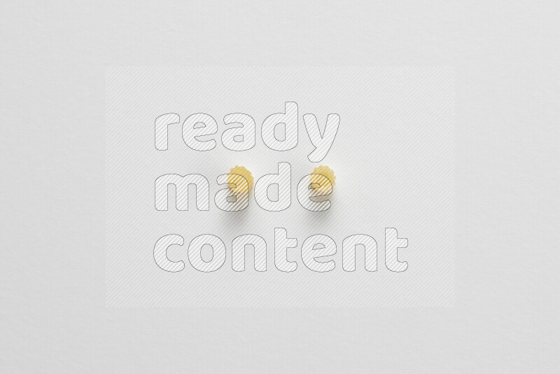 Small rings pasta on white background