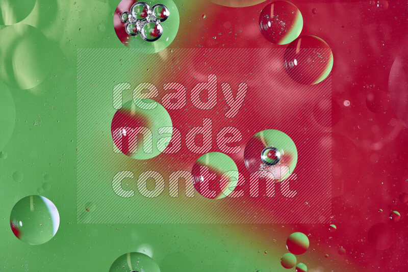 Close-ups of abstract oil bubbles on water surface in shades of green and red