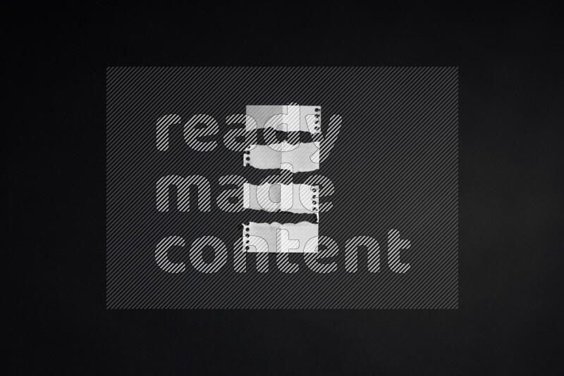 Ripped notebook sheet on black background