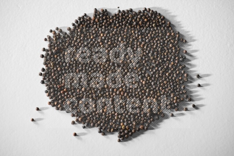 Black pepper on a white flooring