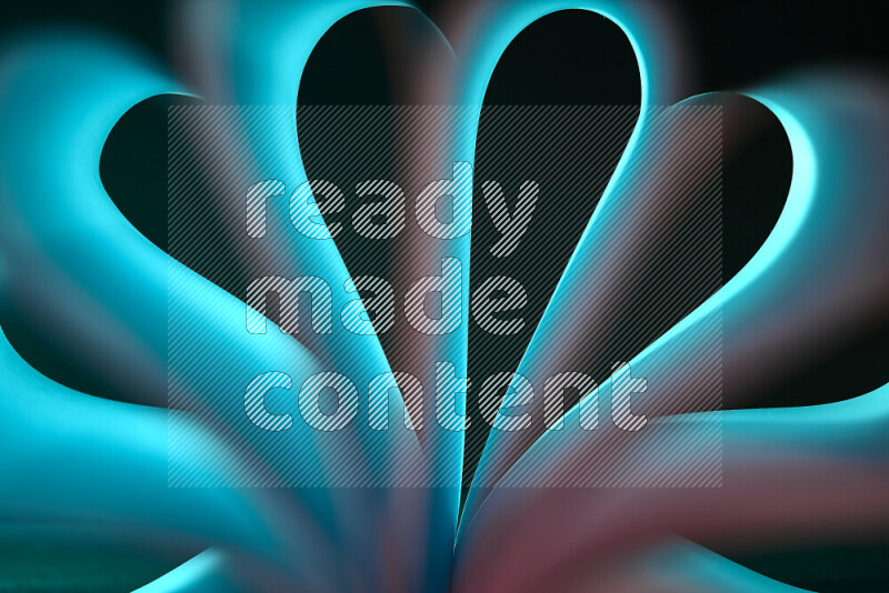 An abstract art piece displaying smooth curves in blue and orange gradients created by colored light